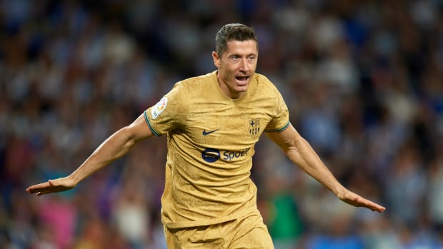 Robert Lewandowski pictured celebrating after scoring his first La Liga goal for Barcelona in a 4-1 win at Real Sociedad in August 2022